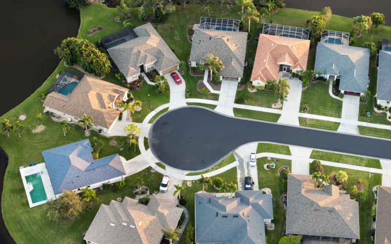 Aerial evening view of spacious family houses in Florida suburban area. Real estate development in American suburbs.