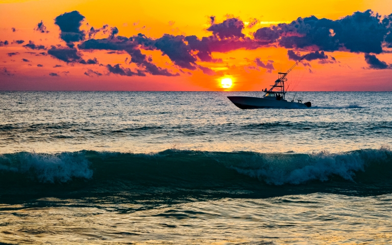 an-outboard-fishing-boat-heading-to-sea-in-the-sun-2026-03-26-11-36-56-utc